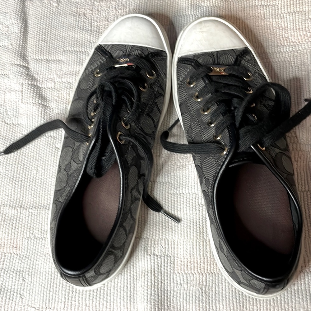 Coach woman’s Size 8.5 canvass tennis shoes. These are in amazing shape.